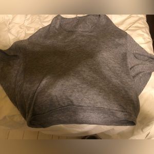 Gray Ya sweater.  Shorter top, cape sleeves